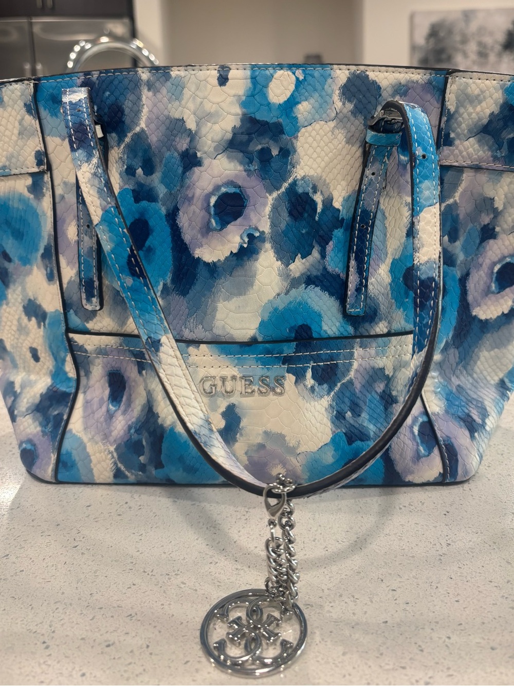 GUESS Blue & White Floral-Print Snakeskin-Textured Tote with Silver Charm